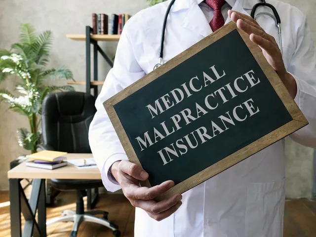 A physician holding a sign saying "medical malpractice insurance"