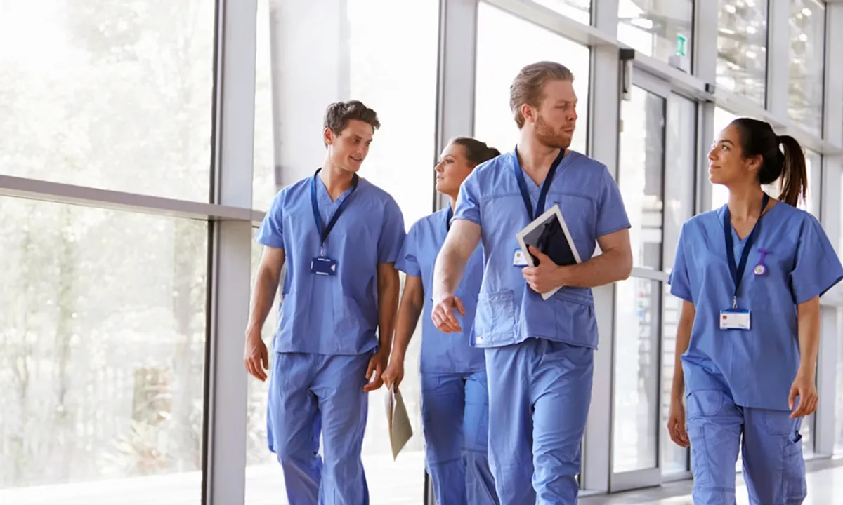 4 healthcare providers walking and talking