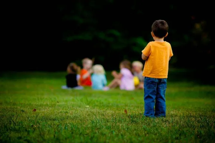 child being excluded, metaphor for outsider