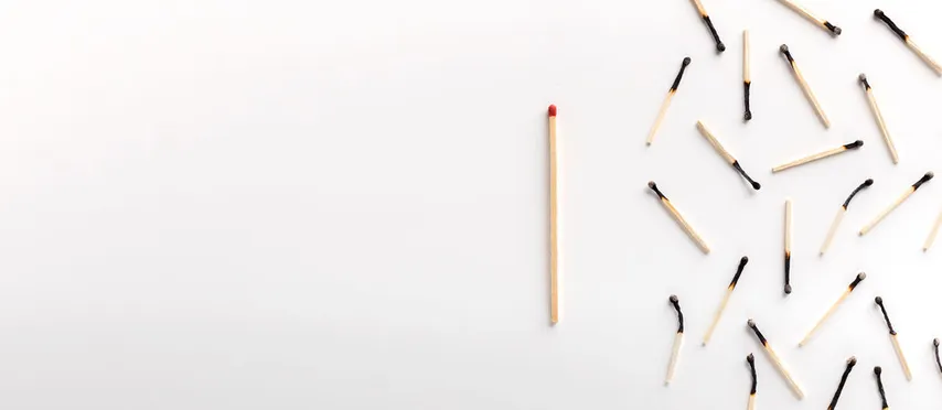 One unlit match among several which are burned. The associated article is about the reasons one physician gives for not feeling "burned out" by his profession.