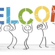 Stick figures holding a banner with the word "welcome." The article advises recruiters on how to conduct successful onboarding.