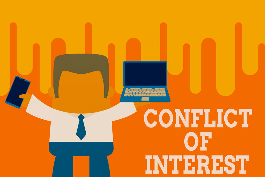 Text sign showing Conflict Of Interest. Conceptual photo disagreeing with someone about goals or targets Standing professional man tie holding left open laptop right mobile phone.