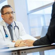 a doctor conducting an interview with a potential candidate
